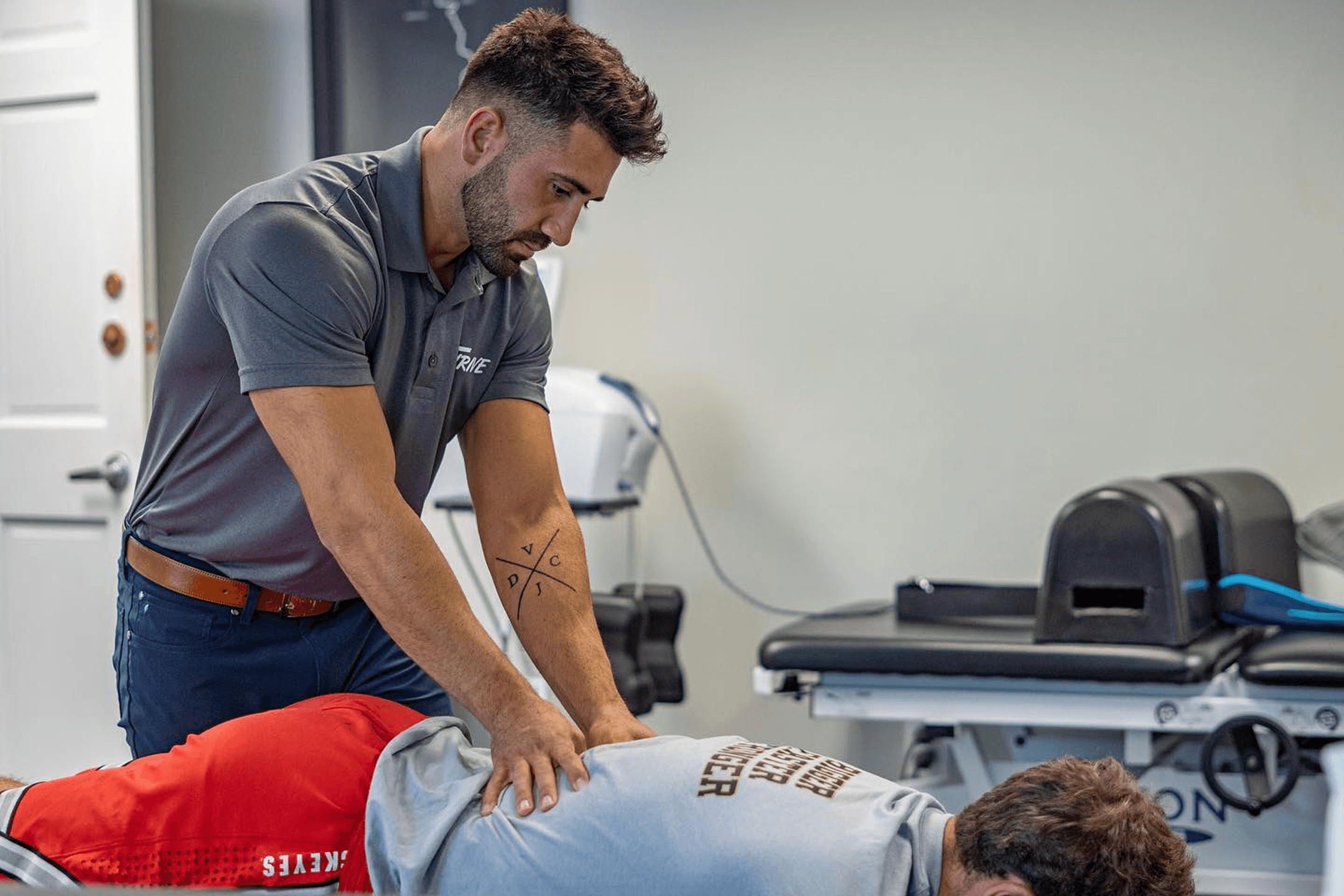 Man getting back adjusted by a Chiropractor