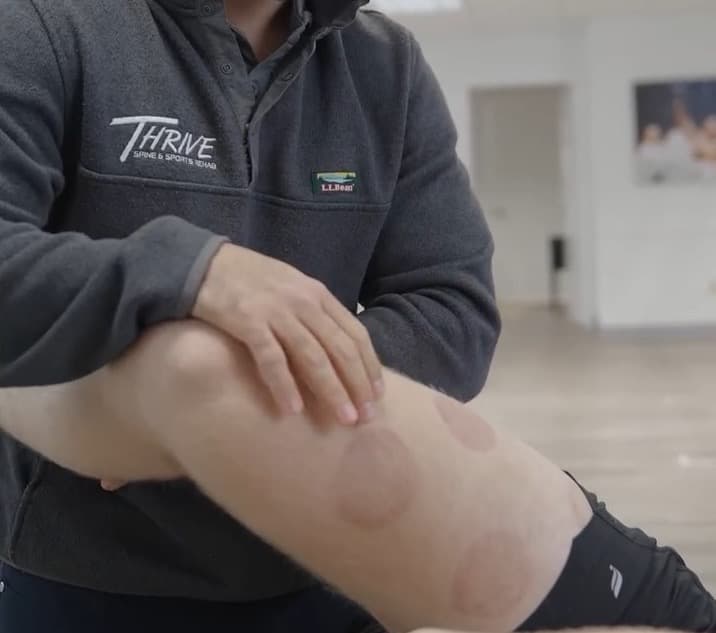 Person receiving chiropractic care at Thrive