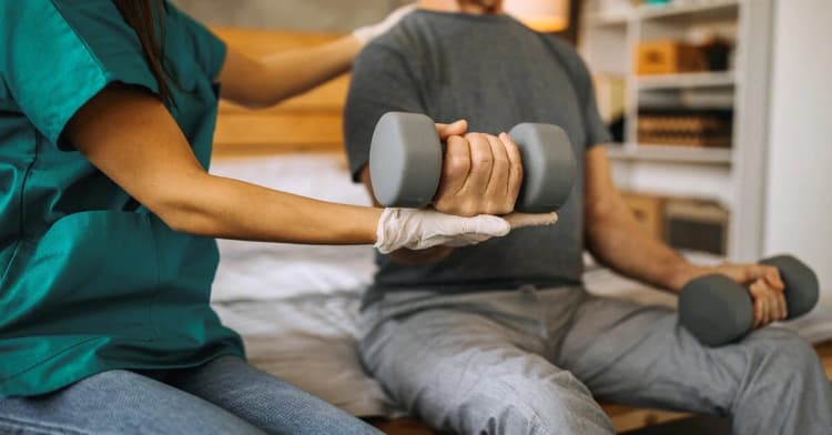 man in physical therapy for tennis elbow
