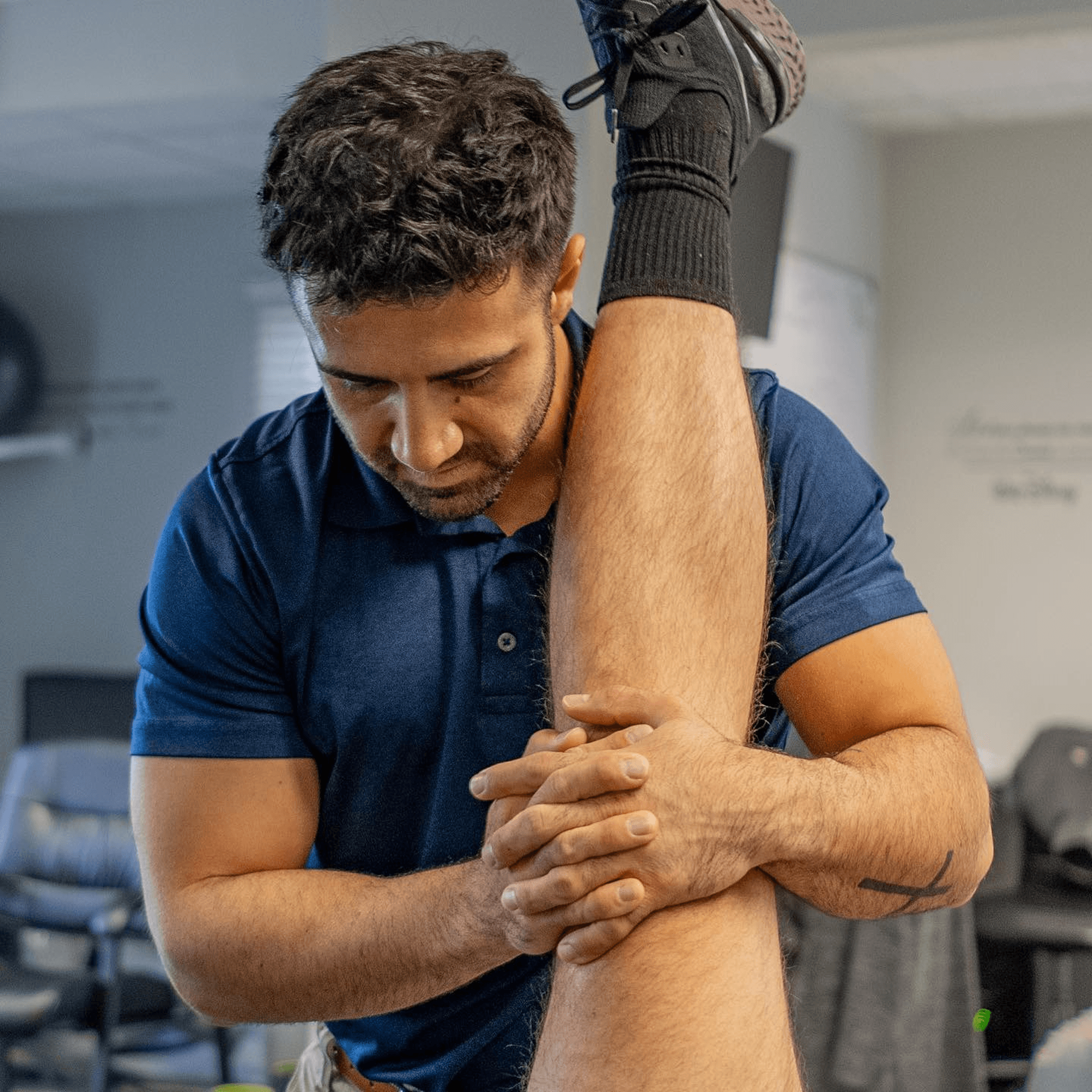 Man receiving physical therapy from a physical therapist
