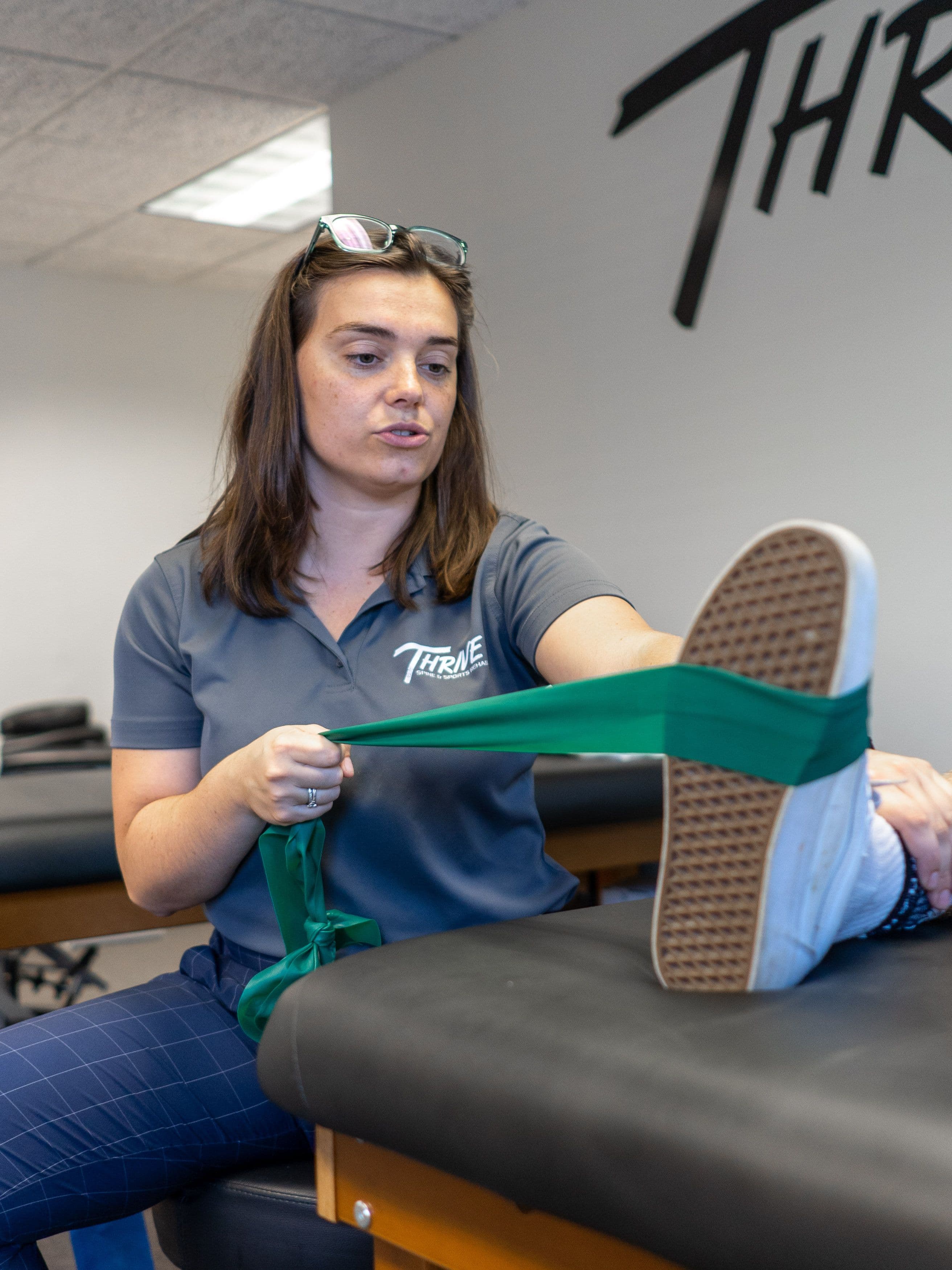 Woman receiving physical therapy from a physical therapist