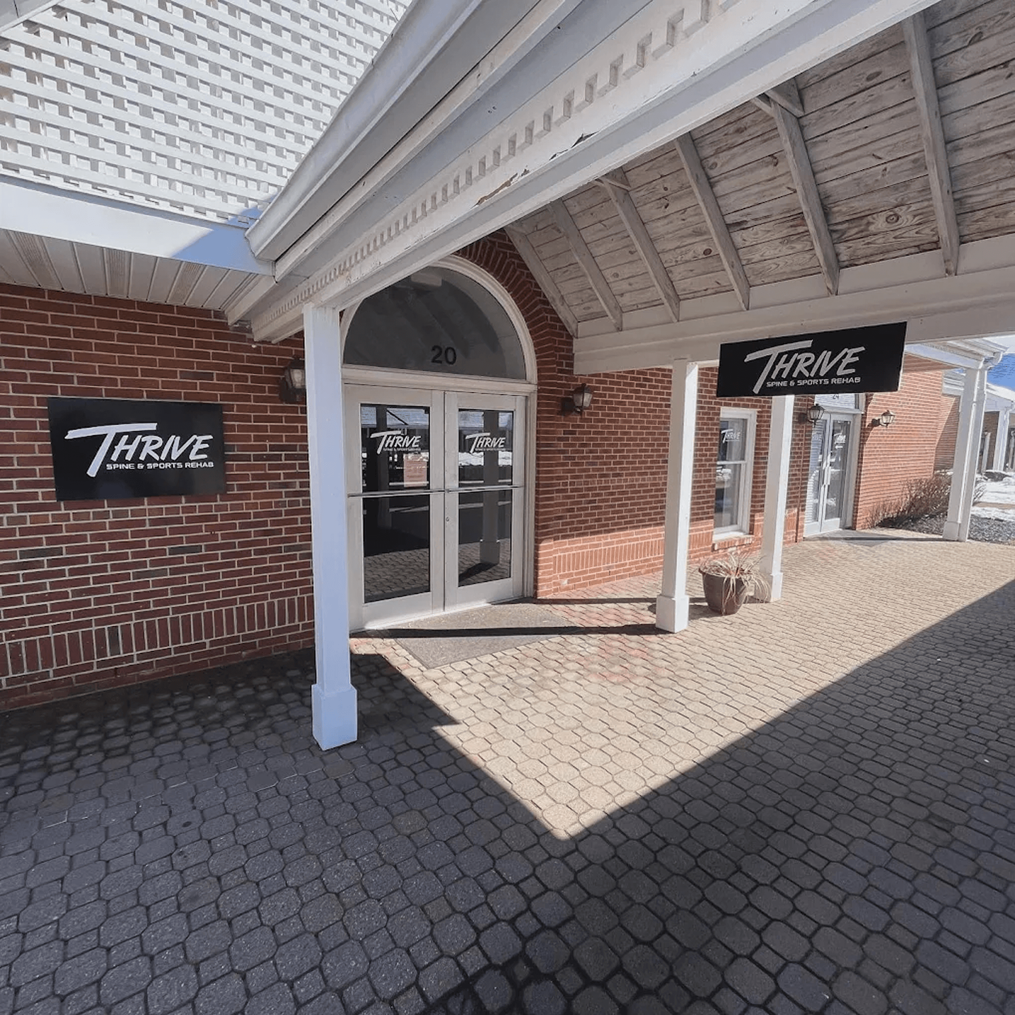 Entrance of Thrive Spine and Sports Rehab at 20 Thoreau Drive, Freehold