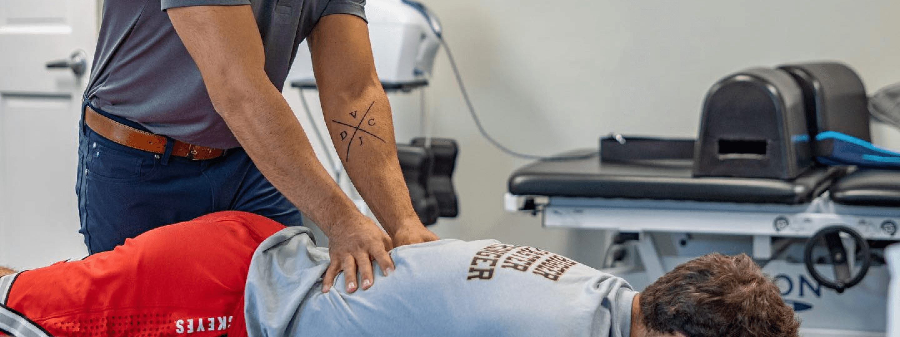 Dr. Vinny Zappola performing a lower-back adjustment at Thrive Freehold