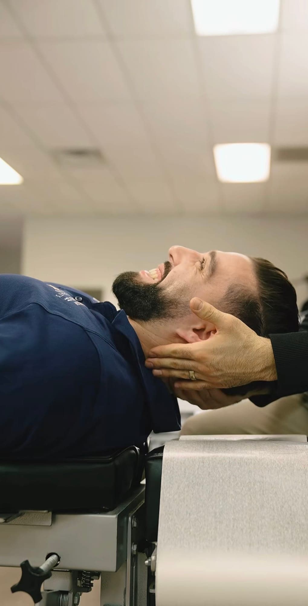 Person receiving chiropractic care at Thrive Spine and Sports Rehab